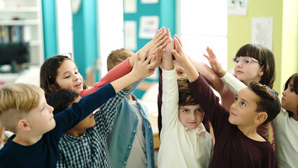 Poster - Group of kids students smiling confident with hands together raised up at classroom