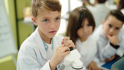 Poster - Group of kids students using microscope at laboratory classroom