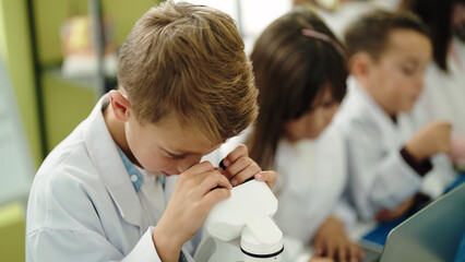 Poster - Group of kids students using microscope at laboratory classroom