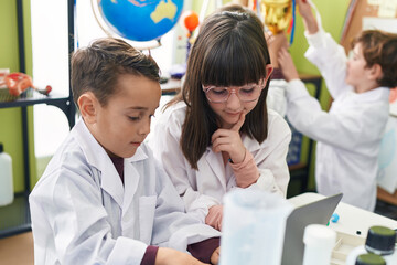 Poster - Group of kids scientists students using laptop at laboratory classroom