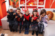 © Krakenimages.com - Group of kids wearing halloween costume doing scare gesture at home