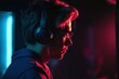 © Angus.YW - a young man with headphones playing a game on a dark background with neon light, studio shot, Generative Ai