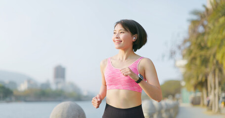 Poster - asian female jogging in city