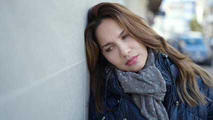 Sticker - Young beautiful hispanic woman looking to the side with serious expression at street