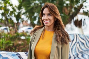 Sticker - Young latin woman smiling confident standing at street