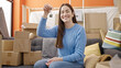 © Krakenimages.com - Young caucasian woman holding keys sitting on sofa at new home