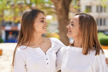 Poster - Two women mother and daughter hugging each other at park