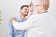 © Krakenimages.com - Mother and son patient and doctor having medical consultation at clinic