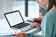 © mojo_cp - Business Woman working with blank white screen laptop.