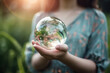 © sommersby - Clean crystal glass ball with flowers inside in woman hands on natural background, Save earth environment ecology concept, created with Generative AI