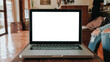 © Satori Studio - Blank screen laptop computer set up for work on white wooden desk, Mockup, Empty screen, Blank screen for product display.