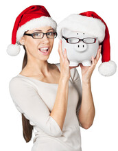 Woman In Santa Hat Holding Piggy Bank, Savings Concept