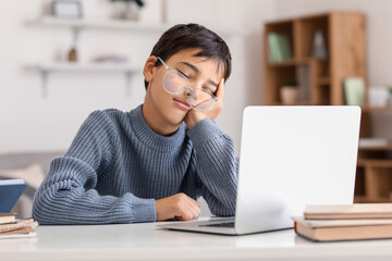 Poster - Little boy in eyeglasses sleeping near laptop at home