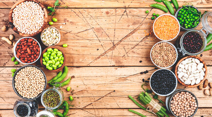 Wall Mural - Legumes, beans and sprouts. Dried, raw and fresh, top view. Lentils, mung beans, chickpeas, soybeans, edamame, peas, Healthy diet food, vegan proetin, micronutrients and fiber sources, top view banner