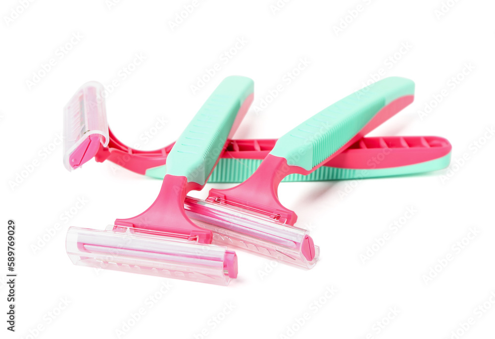 Colorful safety razors on white background