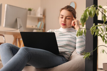 Poster - Female programmer working with laptop in office