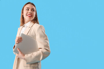 Female programmer with laptop on blue background