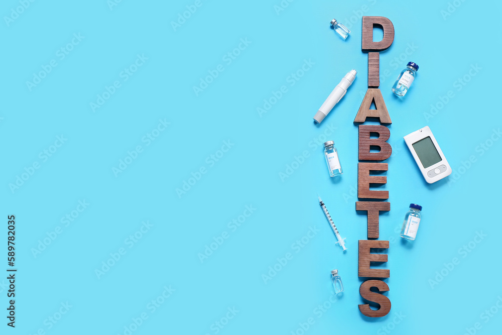 Word DIABETES with insulin, lancet pen and glucometer on blue background