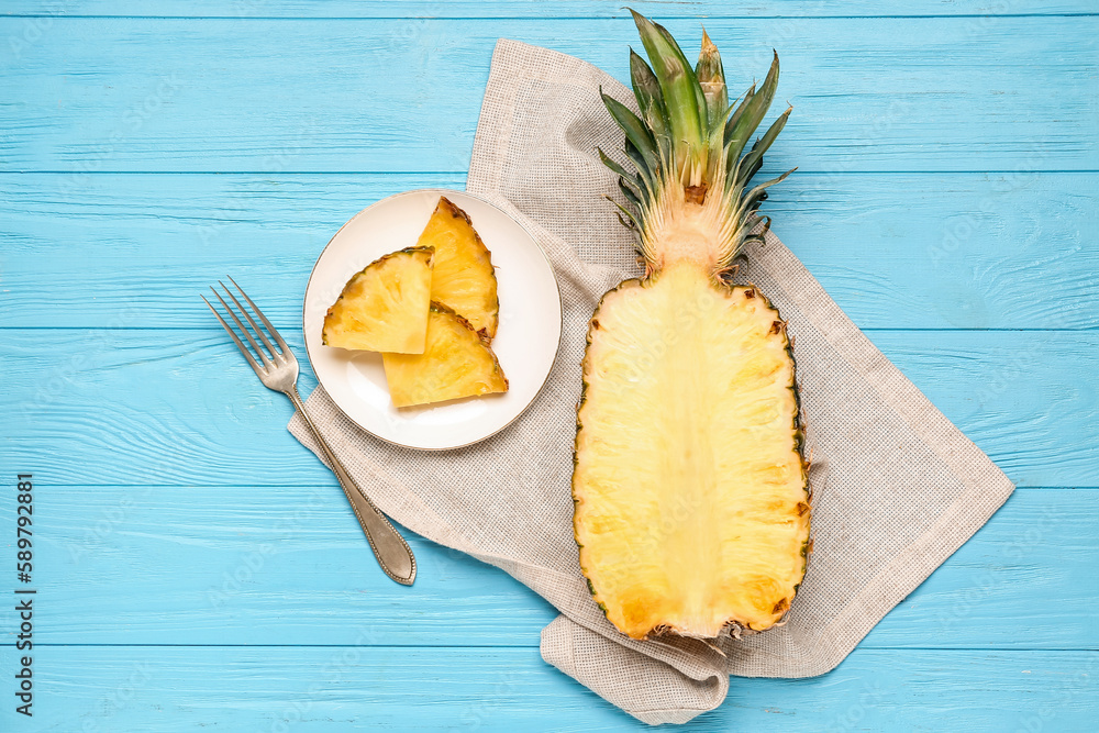 Fresh cut pineapple on blue background