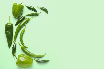 Wall Mural - Composition with green peppers on color background