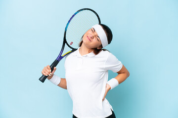 Young tennis player woman isolated on blue background suffering from backache for having made an effort