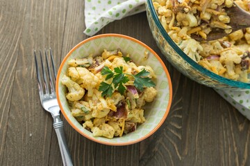 Poster - Top view of a salad with with cauliflower and other veggies on a wooden table