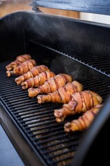 Poster - Grill with chicken legs wrapped in bacon