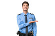 © luismolinero - Young police man over isolated background presenting an idea while looking smiling towards