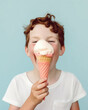 © Uncanny Valley - A sweet little child enjoying the summer sun, a delicious dessert, a melting ice cream cone. Summer refreshment and snacks on the beach. Generative AI.