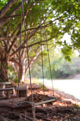 Wall Mural - Swings to sit and relax by the moat