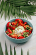 Portion of hummus bowl with poached egg and tomatoes