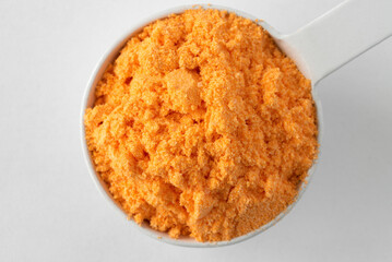 Wall Mural - Cheddar Cheese Powder in a Bowl