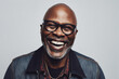 © Trinette Reed - Portrait of mature black man laughing in studio. Generative AI.