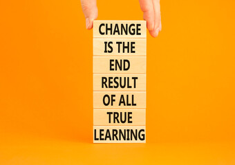 Wall Mural - Change symbol. Concept words Change is the end result of all true learning on wooden blocks. Beautiful orange background. Copy space. Businessman hand. Motivational business change result concept.