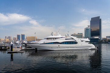 Wall Mural - View across the Creek towards Deira with large boats docked in Dubai, UAE