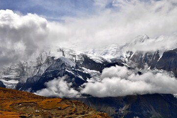 view of gangapurna mountain in clouds. himalaya mountains, annapurna circuit trek, manang district, 