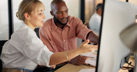 Teamwork, human resources and training with a business woman explaining to an intern working in an office. Marketing, computer and collaboration with a male and female employee team at work together