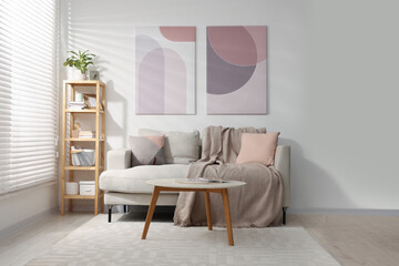 Sticker - Stylish living room interior with sofa, coffee table and wooden shelf