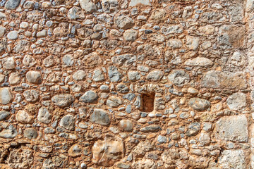 Wall Mural - Empty stonewall with beige cement background texture. Masonry or floor, sunny day. Copy space.