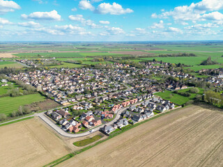 Wall Mural - Drone view of a new housing estate showing detached bungalows in a rural location in Cambridgeshire, UK.
