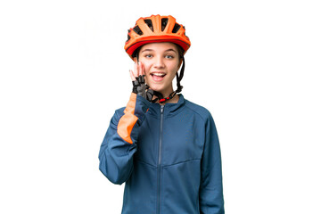 Canvas Print - Teenager cyclist girl over isolated chroma key background with surprise and shocked facial expression