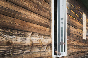 Wall Mural - A large window is installed in an old building