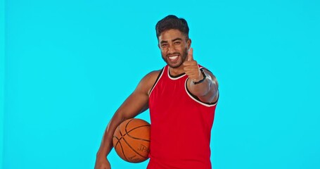 Wall Mural - Man, basketball and thumbs up for success in sports isolated in studio on blue background mockup. Face portrait, happy person and ball spin with emoji for exercise goals, like or hand gesture for yes