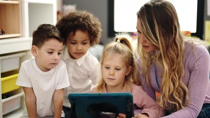 Sticker - Woman and group of kids having lesson using touchpad at kindergarten