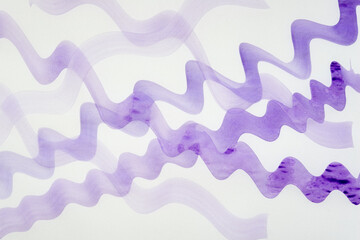 Wall Mural - tracing paper with overlapping wet purple watercolor paint markings on a backlit surface