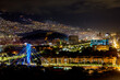 Panoramic night view of Medellin, Colombia, with illuminated bridge
