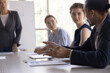 © fizkes - Hands of young Black business professional man talking to colleagues and boss woman on meeting, briefing, speaking to employees at conference table, telling idea on brainstorming