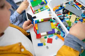 Wall Mural - robotics programming class. children construct and code robot. stem education using constructor bloc