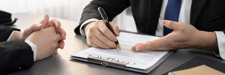 Canvas Print - Closeup businessman sign contract or legal document with pen in his hand during corporate meeting for business deal or legal executive decision to pay off a loan or filing for bankruptcy. Equilibrium