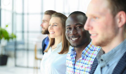 Sticker - Happy smiling business team standing in a row at office.